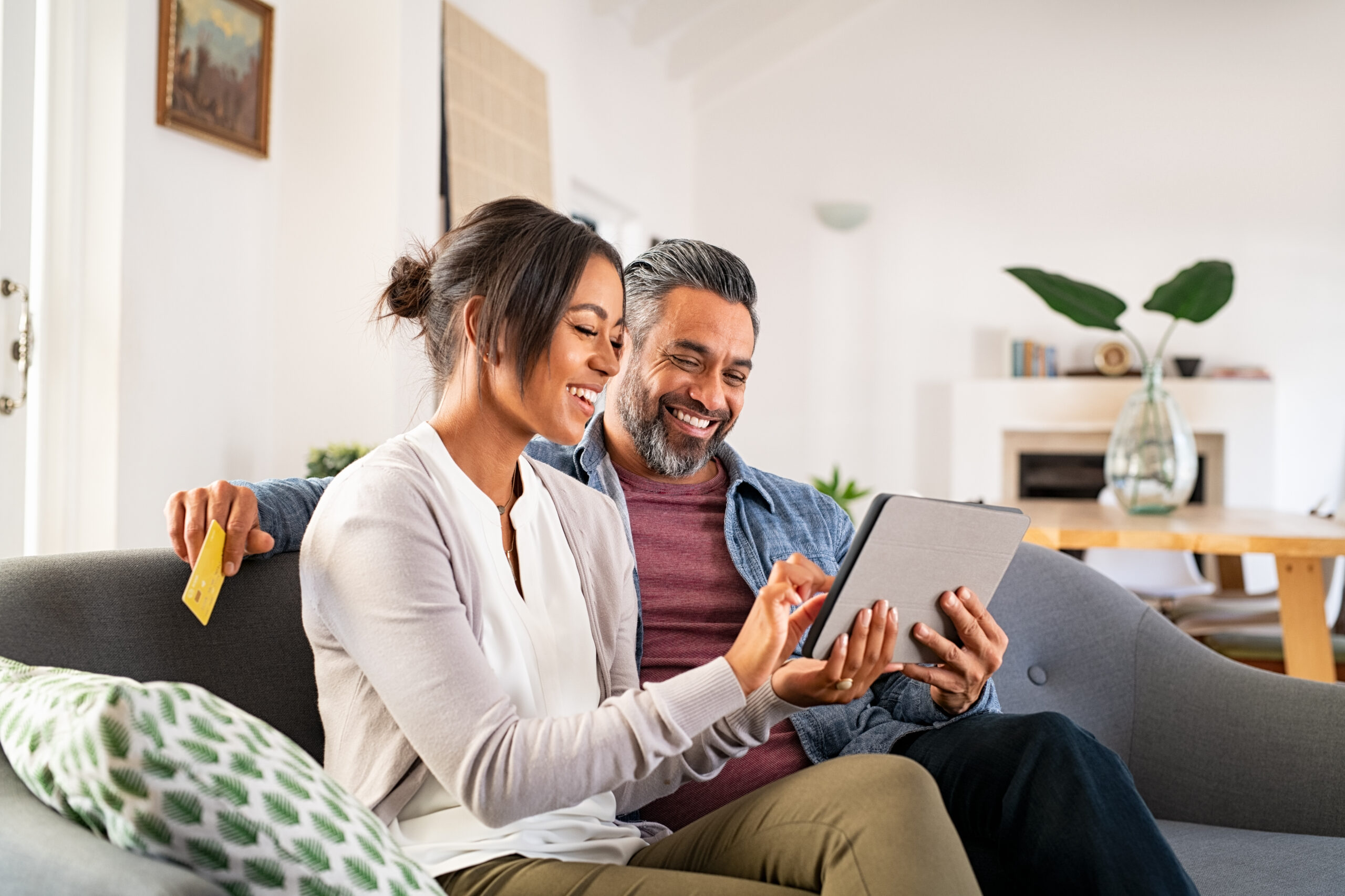 couple grabbing keys to their new home